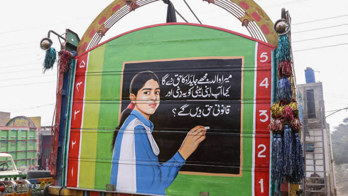 A brightly coloured painting of a girl hangs across the back of a large truck in Pakistan’s province of Punjab. The message beneath it reads, “My father will give me my rightful share in his property. Will you also give your daughter her due share?”