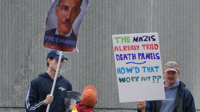 Protesters with 'death panel' Obamacare signs.