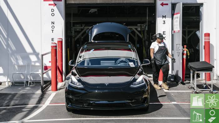 FREMONT, CA - JULY 26: A Tesla Model 3 rolls out of the Tesla factory in Fremont, California, on Thursday, July 26, 2018. (Photo by Mason Trinca for The Washington Post via Getty Images)