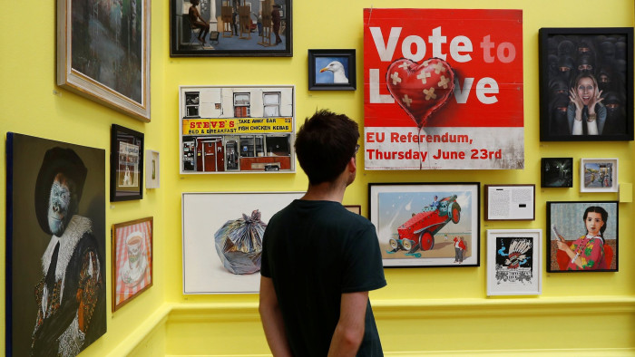 An artwork by artist Banksy entitled Vote to Love is seen amongst other works at the Royal Academy of Arts 250th Summer Exhibition, in London, Britain June 5, 2018. REUTERS/Peter Nicholls NO RESALES. NO ARCHIVES