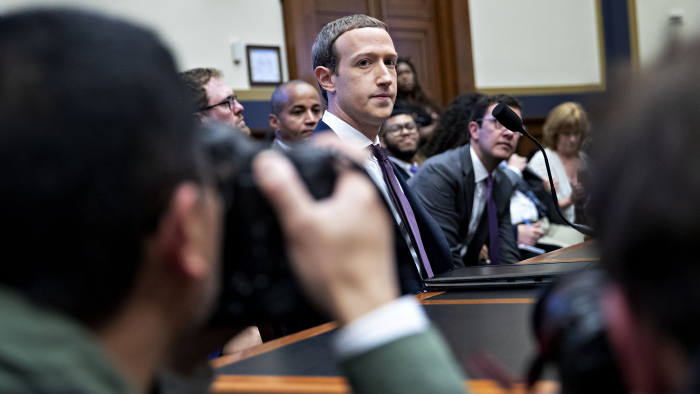 Mark Zuckerberg, chief executive officer and founder of Facebook Inc., arrives after a break during a House Financial Services Committee hearing in Washington, D.C., U.S., on Wednesday, Oct. 23, 2019. Zuckerberg struggled to convince Congress of the merits of the company's plans for a cryptocurrency in light of all the other challenges the company has failed to solve. Photographer: Andrew Harrer/Bloomberg