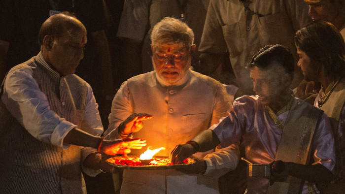 BJP leader Narendra Modi, (centre), performs the Hindu Ganga Puja prayer ritual at the Dashaswamadeh Ghat on the Holy River Ganges the day after his landslide election victory in Varanasi, India on on May 17 2014