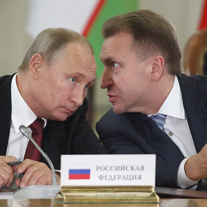 Russia's President Vladimir Putin (L) and First Deputy Prime Minister Igor Shuvalov speak during a session of the Council of Heads of the Commonwealth of Independent States (CIS) in Sochi, Russia October 11, 2017. REUTERS/Maxim Shemetov - UP1EDAB0YI162