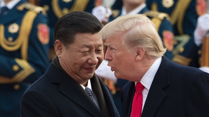 China's President Xi Jinping (L) and US President Donald Trump attend a welcome ceremony at the Great Hall of the People in Beijing on November 9, 2017. / AFP PHOTO / NICOLAS ASFOURI (Photo credit should read NICOLAS ASFOURI/AFP/Getty Images)