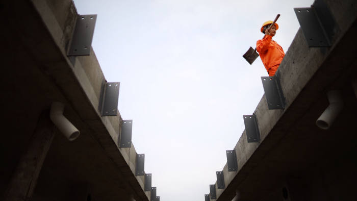 Mandatory Credit: Photo by Xinhua/Shutterstock (10609218f) A worker makes precast beam at a beam production site for the construction of a fast railway in Guiyang, southwest China's Guizhou Province, April 10, 2020. The construction of the southwest ring road fast railway in Guiyang has been resumed in an orderly manner under strict measures taken to fight against the COVID-19. China Guizhou Guiyang Railway Construction - 10 Apr 2020
