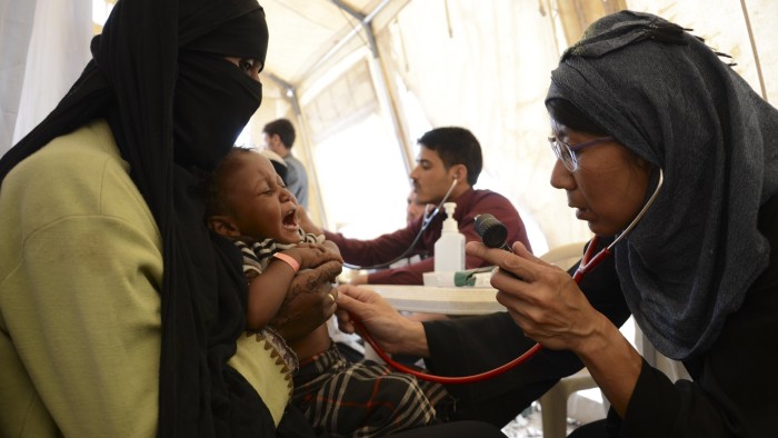 MSF President Joanne Liu checking an IDP baby in an MSF mobile clinic in Khamer. MSF provided more than 5000 general consutlations to IDPS in Khamer in 8 locations