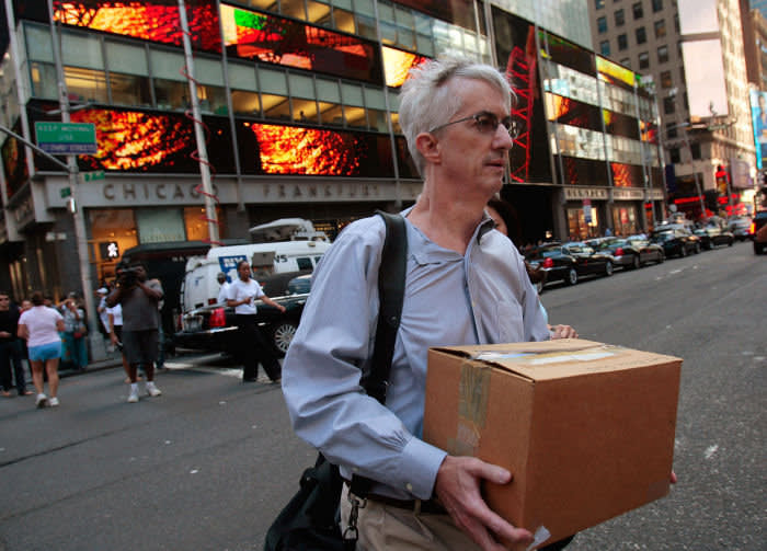 NEW YORK - SEPTEMBER 15: An employee of Lehman Brothers Holdings Inc. carries a box out of the company's headquarters building (background) September 15, 2008 in New York City. Lehman Brothers filed a Chapter 11 bankruptcy petition in U.S. Bankruptcy Court after attempts to rescue the storied financial firm failed. (Photo by Chris Hondros/Getty Images)