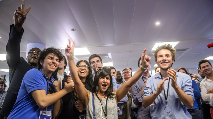 epa06023121 Supporters of 'Le Republique En Marche' (The Republic on the Move, LREM) party react after polls closed for the first round of the French legislative elections in Paris, France, 11 June 2017. First projections showed French President Macron's party 'Le Republique En Marche' (The Republic on the Move, LREM) emerging as the big winner as France holds the first round of parliamentary elections on 11 June 2017, just under two months after Macron took office as French President. EPA/CHRISTOPHE PETIT TESSON