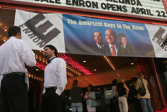 Valet parking attendants stand ready as film-goers line up for the premiere of the Enron documentary &quot;The Smartest Guys in the Room&quot;. Valet parking attendants stand ready as film-goers line up for the premiere of the Enron documentary &quot;The Smartest Guys in the Room&quot; April 20, 2005 in Houston. The movie, based on the book of the same name opens in theatres nationwide April 29th. REUTERS/Richard Carson - RP6DRMTWBAAA