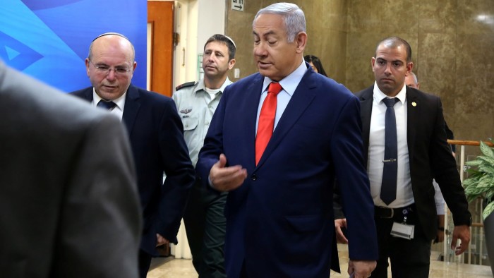 Israeli Prime Minister Benjamin Netanyahu (C) arrives to the weekly cabinet meeting at his Jerusalem office May 12, 2019. Gali Tibbon/Pool via REUTERS