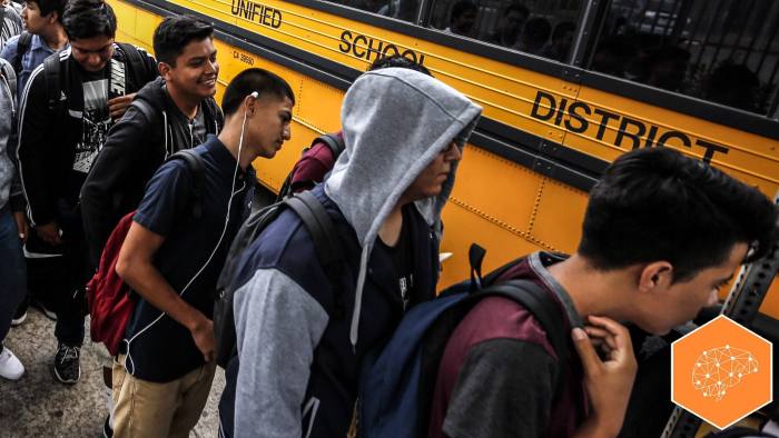 LOS ANGELES ,CA AUGUST 18, 2015: Students line-up for their buses at a district bus stop next to  Jefferson High School in Los Angeles on the first day of classes August 18, 2015. The buses transport the students to middle schools and other high schools in the area  (Photo by Mark Boster / Los Angeles Times via Getty Images)