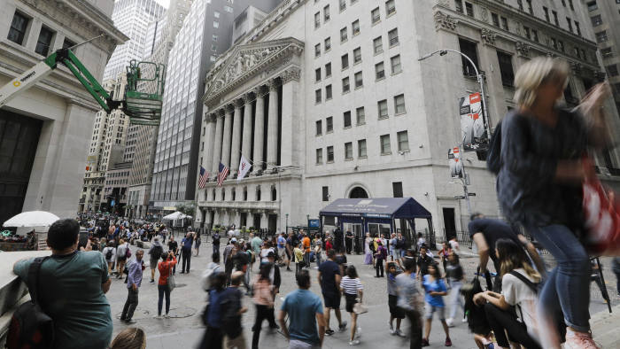 Pedestrians pass the New York Stock Exchange Friday, Aug. 23, 2019 in New York. Stocks fell sharply on Wall Street Friday after President Donald Trump called on U.S. companies to consider alternatives to doing business in China.(AP Photo/Frank Franklin II)