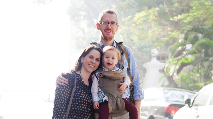 Mumbai, India- 12 March 2016: James, Mary and Alexander walking home in the lanes of Colaba in South Mumbai.