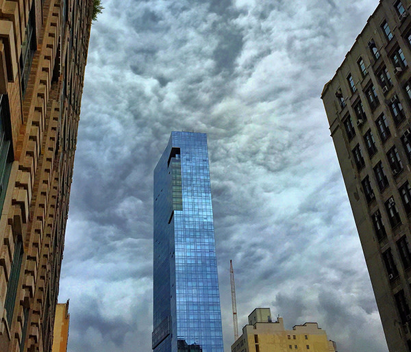 Clouds swirl above a Trump building in SoHo in New York City. 