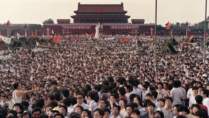 Hundreds of thousands of protesters gather around a replica of the Statue of Liberty, which they called the Goddess of Democracy, in Tiananmen Square, on June 2 1989
