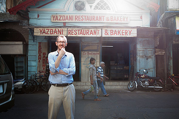 Mumbai, India- 12 March 2016: James Crabtree at the old Yazdani Bakery in Fort area of South Bombay, where he comes often with his son to pick up bun bread.