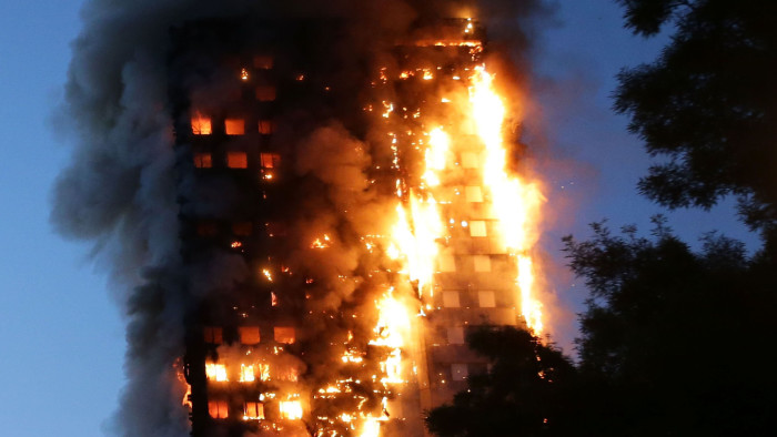 TOPSHOT - Fire engulfs Grenfell Tower, a residential tower block on June 14, 2017 in west London. The massive fire ripped through the 27-storey apartment block in west London in the early hours of Wednesday, trapping residents inside as 200 firefighters battled the blaze. Police and fire services attempted to evacuate the concrete block and said &quot;a number of people are being treated for a range of injuries&quot;, including at least two for smoke inhalation. / AFP PHOTO / Daniel LEAL-OLIVASDANIEL LEAL-OLIVAS/AFP/Getty Images