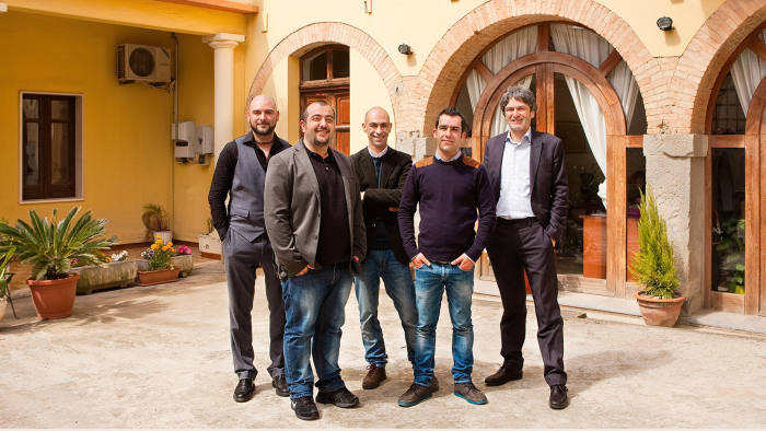 Sardex’s founders outside their office in Serramanna, Sardinia