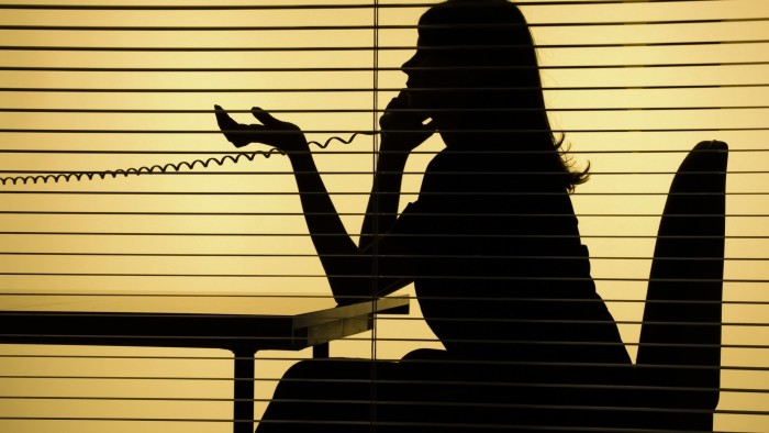 Silhouette of woman on the phone
