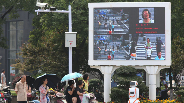 XIANGYANG, CHINA - JUNE 26: Facial recognition equipment and a screen are installed at an intersection to shame jaywalkers on June 26, 2017 in Xiangyang, Hubei Province of China. (Photo by Visual China Group via Getty Images/Visual China Group via Getty Images)