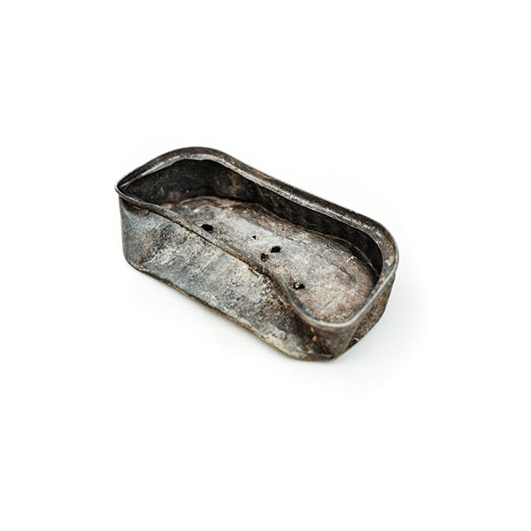 Siblings Aichadou, aged six, and Ibrahim, four, found this old sardine tin on a rubbish dump, and treasure it as part of their make-believe kitchen.