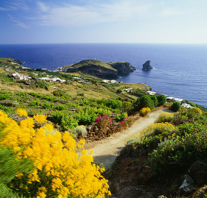 Italy, Sicily, Trapani district, Pantelleria, Cala Levante, Mediterranean sea, View towards the inlet and the Faraglione