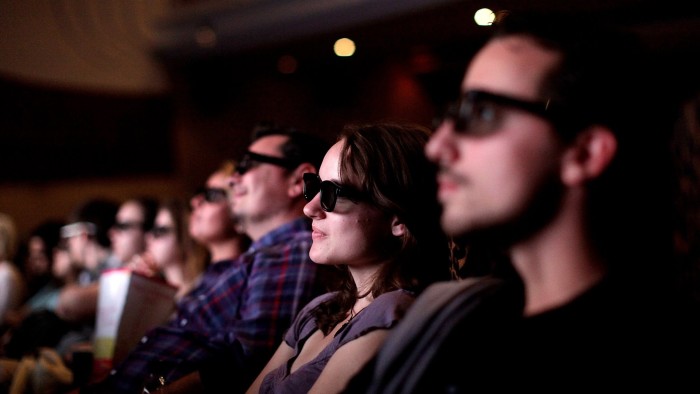 Customers wear 3D glasses as they watch Harry Potter and the Deathly Hallows - part 2 at the Odeon cinema on Leicester Square, in London, U.K., on Friday, July 15, 2011. BC Partners Ltd. and Omers Private Equity Inc. submitted a final offer to buy the Odeon and UCI cinema chain from Guy Hands Õs Terra Firma Capital Partners Ltd., said two people with knowledge of the matter. Photographer: Simon Dawson/Bloomberg