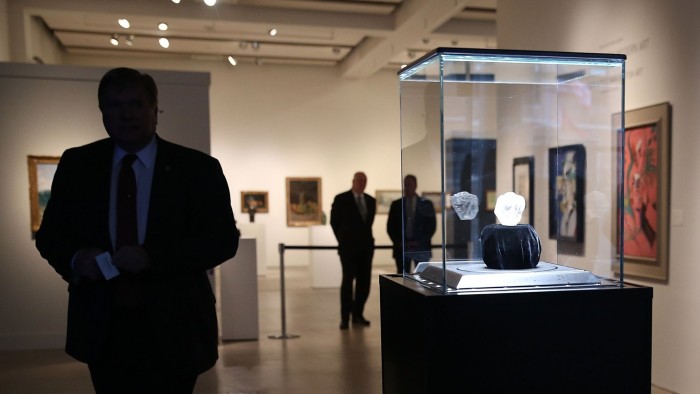 Sotheby's To Auction Off Largest Diamond Discovered In 100 Years...NEW YORK, NY - MAY 04: The 1109-carat rough Lesedi La Rona diamond, the biggest rough diamond discovered in more than a century, sits in a display case at Sotheby's on May 4, 2016 in New York City. The stone was found by Lucara Diamond Corp. last year at its Karowe mine in Botswana. The diamond, which is nearly the size of a tennis ball at 66.4 x 55 x 42mm and is believed to be about 2.5 billion to 3 billion years old, was named &quot;Our Light&quot; in the local Tswana language. Lesedi La Rona will be offered at auction in London on June 29 and be on display at Sotheby's New York. The diamond could sell for $70 million or more. (Photo by Spencer Platt/Getty Images)