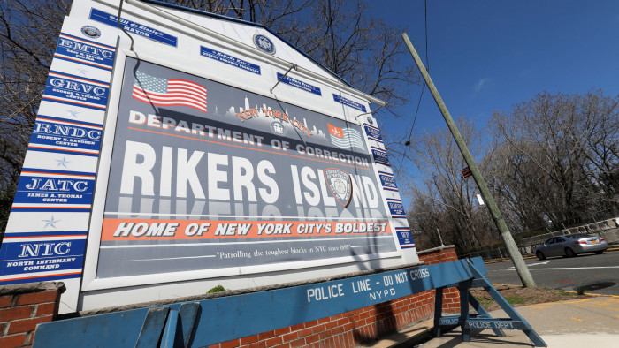 Signage is seen outside of Rikers Island, a prison facility, where multiple cases of the coronavirus disease (COVID-19) have been confirmed in Queens, New York City, U.S., March 22, 2020. REUTERS/Andrew Kelly