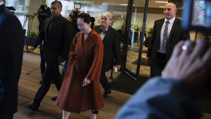 Meng Wanzhou, chief financial officer of Huawei Technologies Co., center, leaves the Supreme Court for a lunch break from a hearing in Vancouver, British Columbia, Canada, on Monday, Sept. 23, 2019. Wanzhou returned to a Vancouver courtroom Monday to fight extradition as Canadian voters deliberate who's best suited to helm an unprecedented confrontation with China over her plight. Photographer: Taehoon Kim/Bloomberg