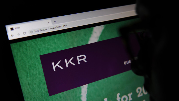 RGB7XM The private equity firm KKR & Co. Inc website seen through a magnifying glass