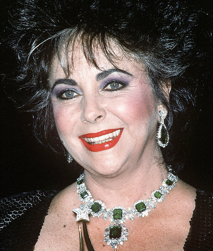 English actress Elizabeth Taylor (1932 - 2011) wearing her emerald and diamond Bulgari necklace, circa 1986. (Photo by Kypros/Getty Images)