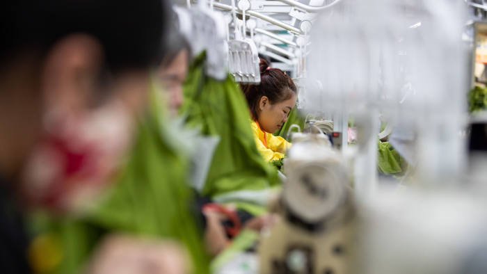 Employees use sewing machines at the Pan-Pacific Co. Viet Pacific Clothing (VPC) factory in Vo Cuong, Bac Ninh province, Vietnam, on Friday, March 1, 2019. Pan Pacific manufactures and exports feather-down products, apparel, bedding goods, and needlework products. Photographer: SeongJoon Cho/Bloomberg via Getty Images