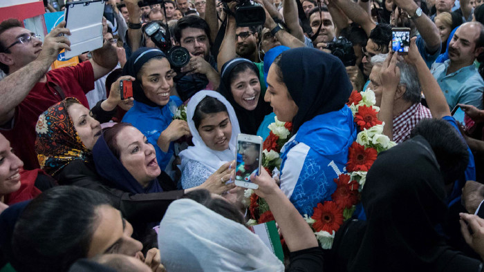 Kimia Alizadeh, who became the first Iranian woman ever to win an Olympic medal, is  cheered by her compatriots and met by the press upon her arrival at Imam Khomeini International Airport in the capital Tehran, on August 26,2016.