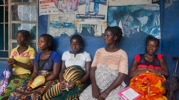 Pregnant women wait for a check-up at the Tikonko community health clinic