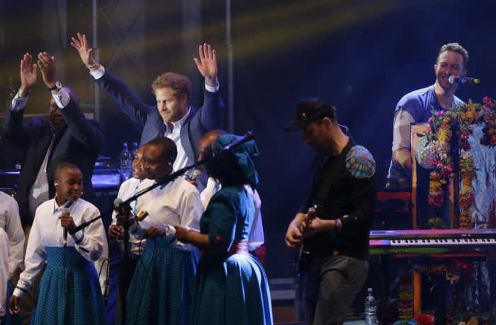 LONDON, ENGLAND - JUNE 28: Prince Harry is seen on stage with Chis Martin of Coldplay during the final performance at the Sentebale Concert at Kensington Palace on June 28, 2016 in London, England. Sentebale was founded by Prince Harry and Prince Seeiso of Lesotho over ten years ago. It helps the vulnerable and HIV positive children of Lesotho and Botswana. (Photo by Matt Dunham - WPA Pool/Getty Images)