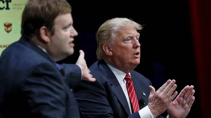 U.S. Republican presidential candidate Donald Trump (R) responds to a question from Frank Luntz at the Family Leadership Summit in Ames, Iowa, United States, July 18, 2015. REUTERS/Jim Young   - GF10000163533