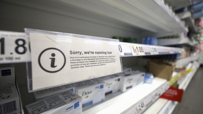 An advisory informs customers they are limited to purchase only two anti-bacterial hand santizier gels each on an empty shelf edge in the soap aisle at an Asda supermarket, operated by Walmart Inc., in Wheatley, U.K., on Friday, March 6, 2020. The stockpiling crisis that has hit supermarkets across Asia has spread to Europe as consumers start hoarding groceries and hygiene products amid fears of a coronavirus pandemic. Photographer: Chris Ratcliffe/Bloomberg