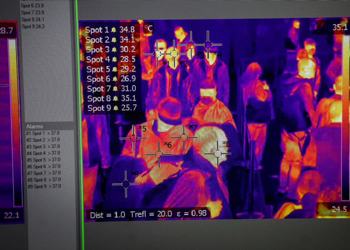 A thermal scan image of arriving passengers is displayed on a screen at border control to help monitor possible coronavirus cases, at Belgrade Nikola Tesla Airport in Belgrade, Serbia, on Monday, March 2, 2020. Governments struggling to contain the global economic fallout from the coronavirus outbreak face mounting calls to unleash a major fiscal stimulus that could help cushion the blow. Photographer: Oliver Bunic/Bloomberg