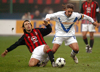 Andrea Pirlo in action for AC Milan in 2002, against Roberto Baggio
