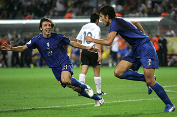 Pirlo (left), after setting up Grosso (right) for the goal that beat Germany in the 2006 World Cup semi-final