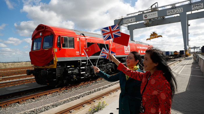 New Silk Road: Chinese women waving flags on April 10, when the first UK-to-China export train departed laden with British goods