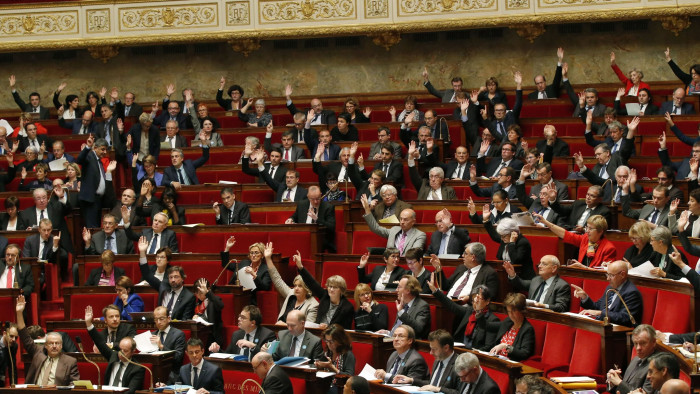 Members of France's National Assembly vote to extend the country's state of emergency