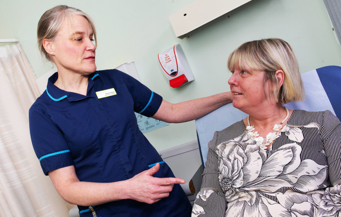 Natasha Kelly, lead nurse at the diabetes department at Leeds Teaching Hospital, NHS Trust treating and educating a patient.