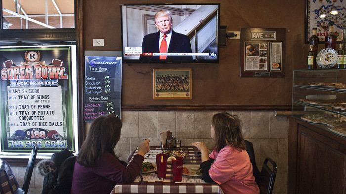 Customers watch television on the day of Donald Trump's presidential inauguration, at W's Bar and Restaurant, on Staten Island in New York, Jan. 20, 2017. The owners are Trump supporters. (Bryan Anselm/The New York Times) Credit: New York Times / Redux / eyevine For further information please contact eyevine tel: +44 (0) 20 8709 8709 e-mail: info@eyevine.com www.eyevine.com