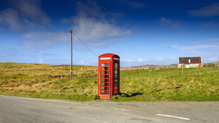 Symbol of the past: an old red BT telephone box on the Isle of Skye, Scotland. The company traces its roots back to the mid-19th century