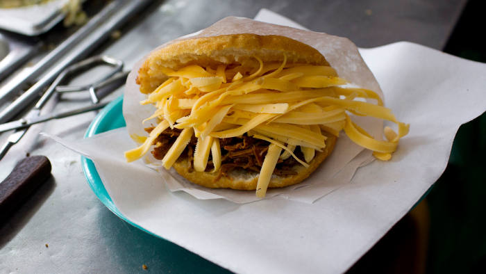 A fried arepa stuffed with meat and cheese is seen in the restaurant in Caracas September 21, 2011