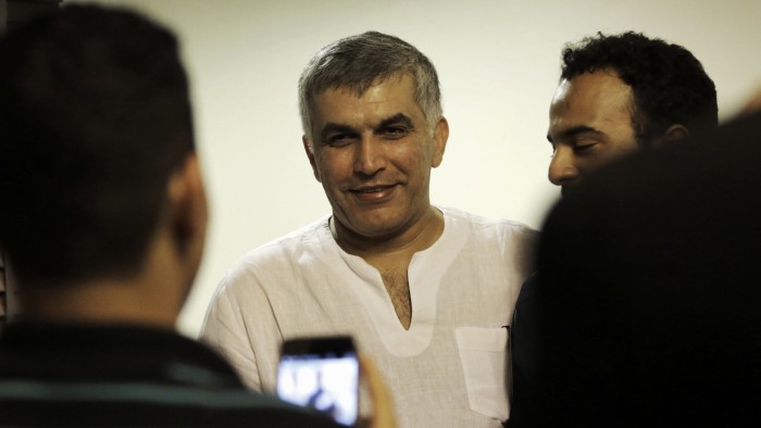 Bahraini human rights activist Nabeel Rajab (C) is greeted by relatives at his home in the village of Bani Jamrah, west of Manama, earlier on July 14, 2015, after his release from prision. Bahrain's king pardoned an outspoken Bahraini human rights activist after three months in prison, citing health reasons, reported the official Bahrain News Agency. AFP PHOTO/MOHAMMED AL-SHAIKH (Photo credit should read MOHAMMED AL-SHAIKH/AFP/Getty Images)