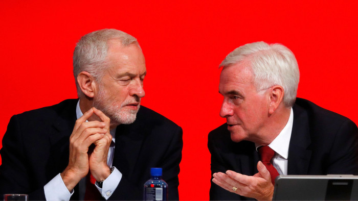 The Labour Party's shadow Chancellor of the Exchequer John McDonnell speaks to party leader Jeremy Corbyn at the party's conference in Liverpool, Britain, September 24, 2018. REUTERS/Phil Noble - RC17CDB30800