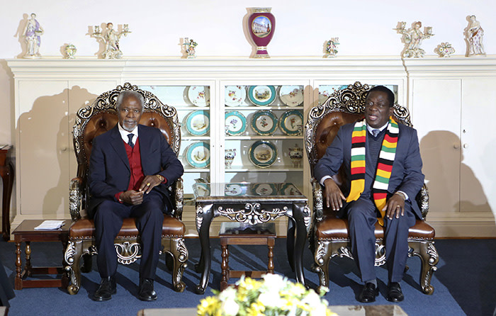 Members of the The Elders foundation Kofi Annan, left, meets with Zimbabwean President Emmerson Mnangagwa at State House in Harare, Zimbabwe, Friday, July, 20, 2018. The visit to Zimbabwe is a key focus of concern for The Elders in providing support as the country prepares to hold elections on July 30. (AP Photo/Tsvangirayi Mukwazhi)